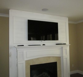 TV mounted over a fireplace